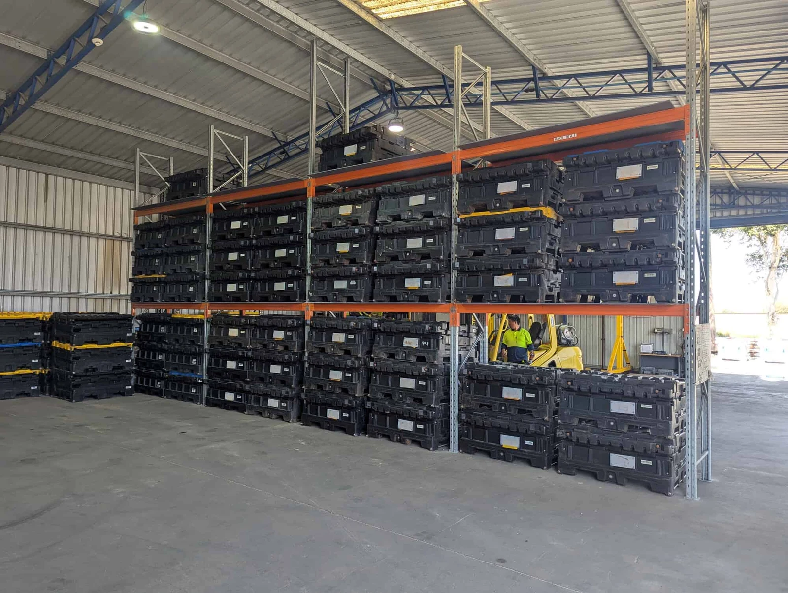 Empty BTS Containers stored in warehouse racking ready for deployment